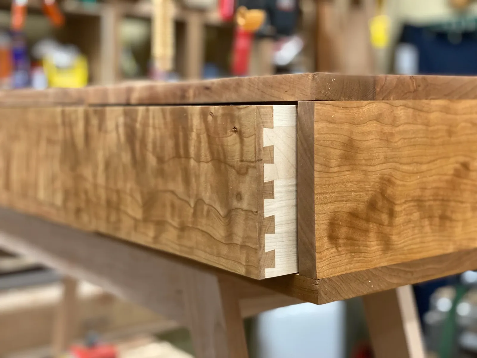 Dovetailed drawer in curly maple